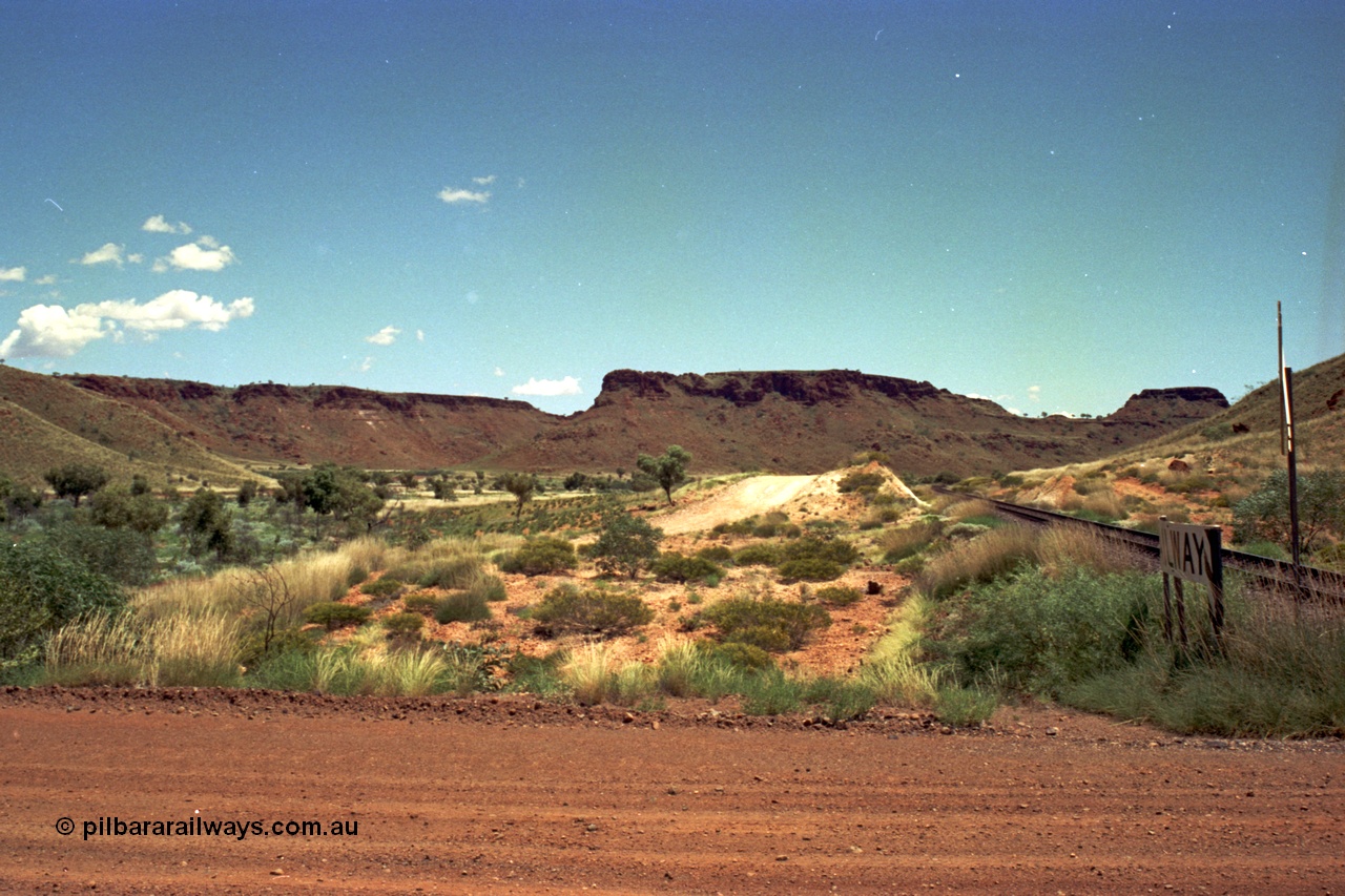220-11
Shay Gap, Mable Bar Rd grade crossing at the 187.6 km on the line to Yarrie, looking towards Yarrie.

