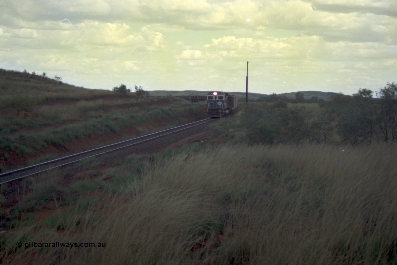 220-14
Just west of the 104.6 km crossing on the Yarrie line, BHP Iron Ore Goninan rebuilt ALCo C636 5431 into a C36-7M unit 5507 serial number 4839-03 / 87-072 seen here leading its loaded train through the curves.
Keywords: 5507;Goninan;GE;C36-7M;4839-03/87-072;rebuild;AE-Goodwin;ALCo;C636;5461;G6035-2;