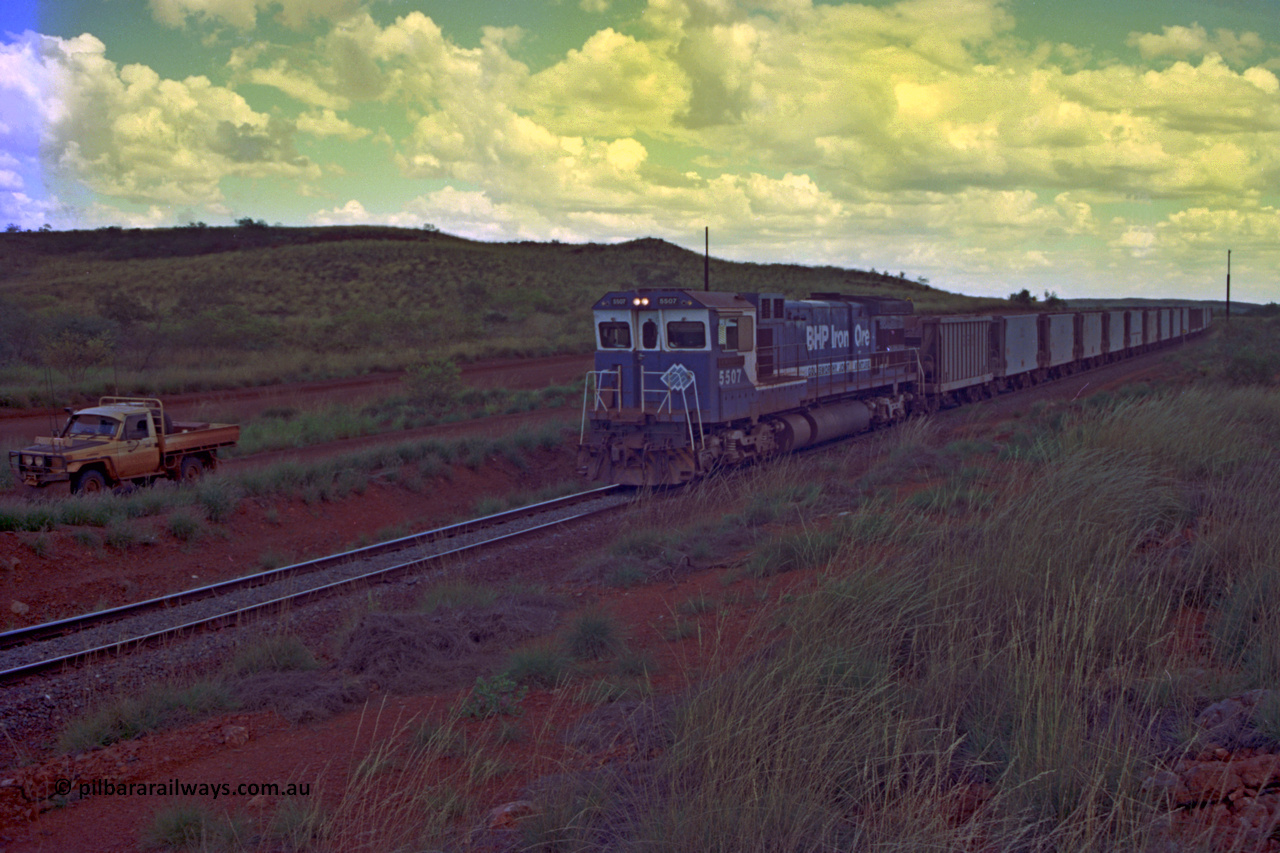 220-16
Just west of the 104.6 km crossing on the Yarrie line, BHP Iron Ore Goninan rebuilt ALCo C636 5431 into a C36-7M unit 5507 serial number 4839-03 / 87-072 seen here leading its loaded train through the curves.
Keywords: 5507;Goninan;GE;C36-7M;4839-03/87-072;rebuild;AE-Goodwin;ALCo;C636;5461;G6035-2;