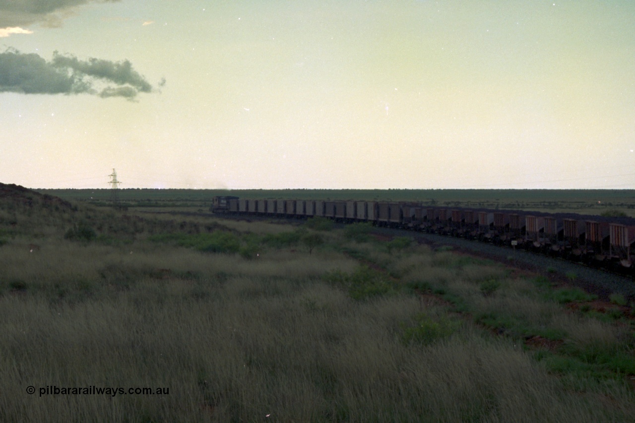 220-18
Just west of the 104.6 km crossing on the Yarrie line, BHP Iron Ore Goninan rebuilt ALCo C636 5431 into a C36-7M unit 5507 serial number 4839-03 / 87-072 seen here leading its loaded train through the curves.
Keywords: 5507;Goninan;GE;C36-7M;4839-03/87-072;rebuild;AE-Goodwin;ALCo;C636;5461;G6035-2;