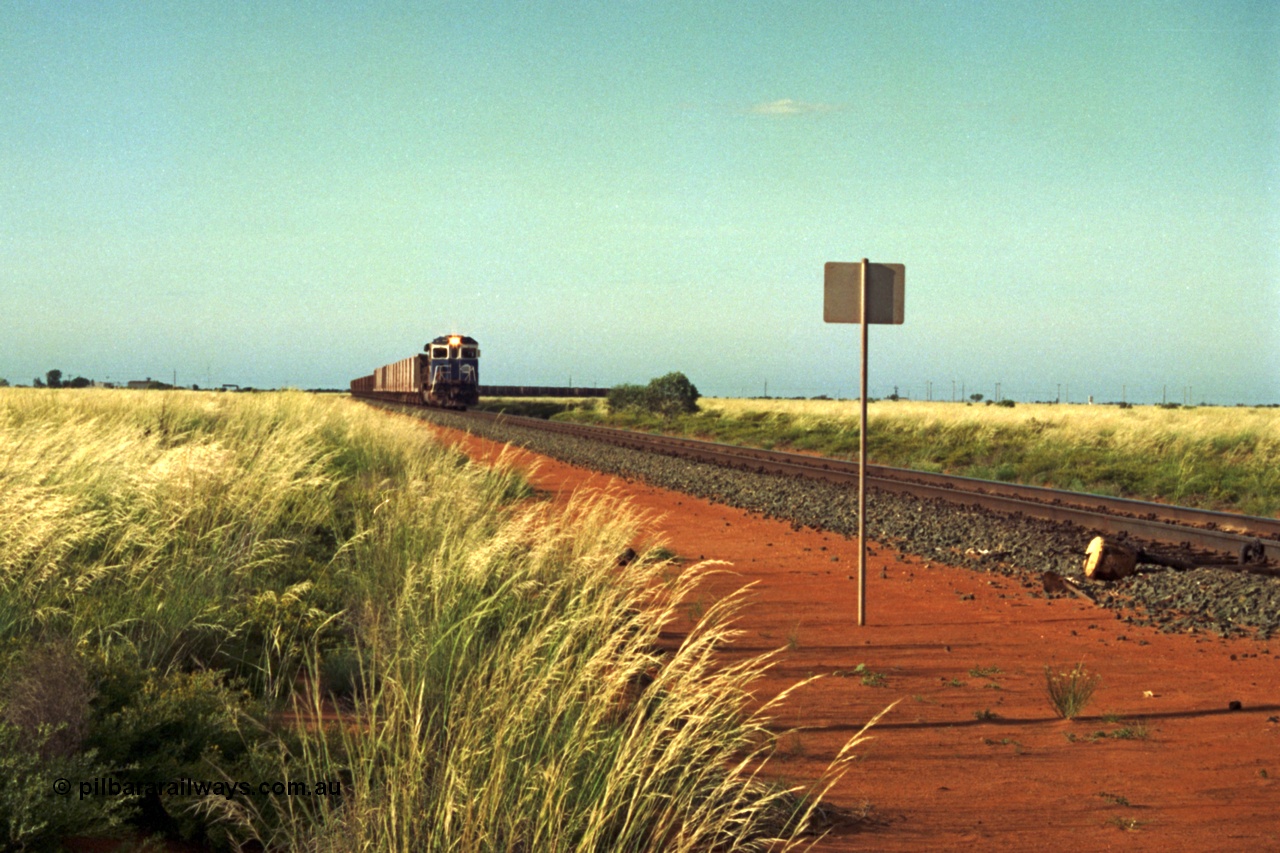 220-21
Goldsworthy Junction, a loaded train from Yarrie mine lead by BHP Dash 7 unit 5507 'Nimingarra' serial 4839-03 / 87-072 was rebuilt by Goninan WA from an ALCo C636 unit 5461 into GE model C36-7M in 1987.
Keywords: 5507;Goninan;GE;C36-7M;4839-03/87-072;rebuild;AE-Goodwin;ALCo;C636;5461;G6035-2;