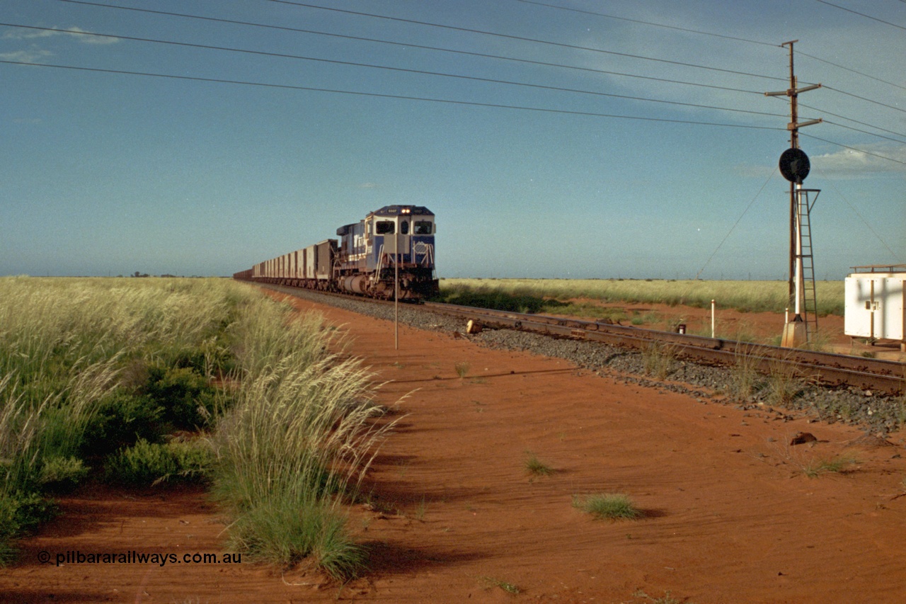 220-23
Goldsworthy Junction, a loaded train from Yarrie mine lead by BHP Dash 7 unit 5507 'Nimingarra' serial 4839-03 / 87-072 was rebuilt by Goninan WA from an ALCo C636 unit 5461 into GE model C36-7M in 1987.
Keywords: 5507;Goninan;GE;C36-7M;4839-03/87-072;rebuild;AE-Goodwin;ALCo;C636;5461;G6035-2;