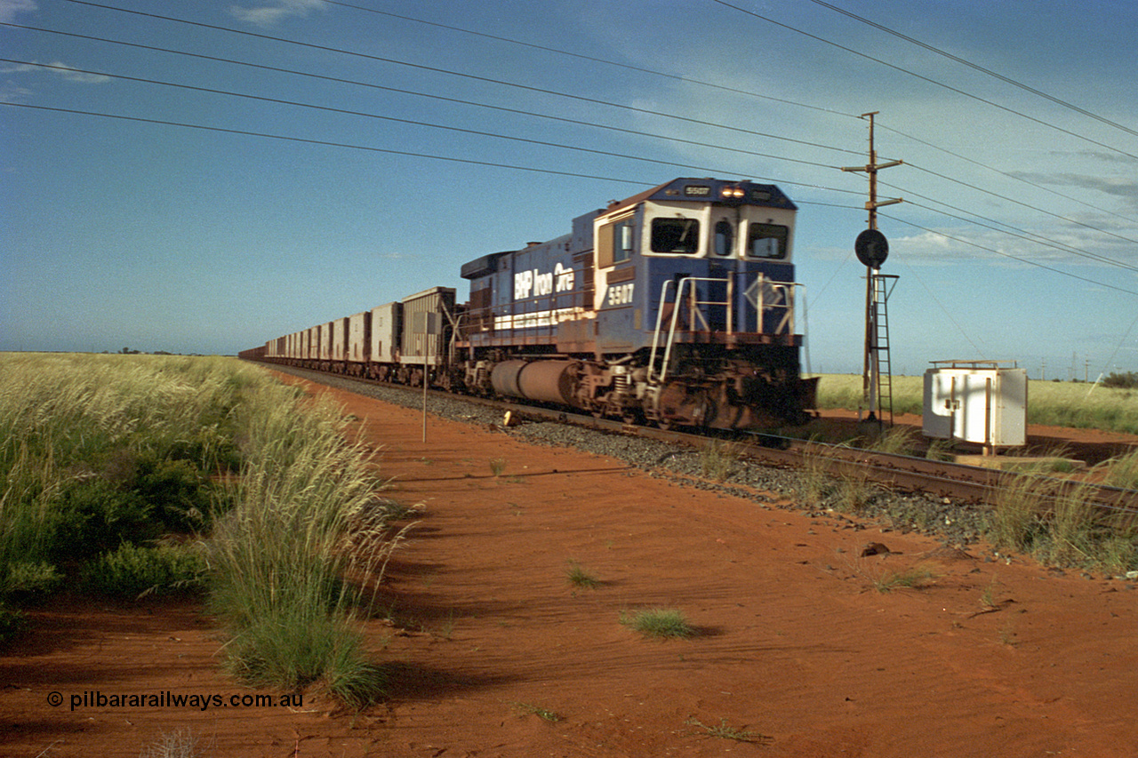 220-24
Goldsworthy Junction, a loaded train from Yarrie mine lead by BHP Dash 7 unit 5507 'Nimingarra' serial 4839-03 / 87-072 was rebuilt by Goninan WA from an ALCo C636 unit 5461 into GE model C36-7M in 1987.
Keywords: 5507;Goninan;GE;C36-7M;4839-03/87-072;rebuild;AE-Goodwin;ALCo;C636;5461;G6035-2;