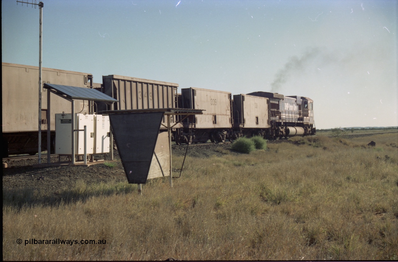 221-10
Hardie Siding, with the days of C36-7M operations numbered, Goninan rebuild 5513 serial 88-078 / 4839-02 from ALCo C636 5453 heads away from Hardie past the location equipment and the train crew shelter with a loaded train bound for Finucane Island.
Keywords: 5513;Goninan;GE;C36-7M;4839-02/88-078;rebuild;AE-Goodwin;ALCo;C636;5453;G6012-2;