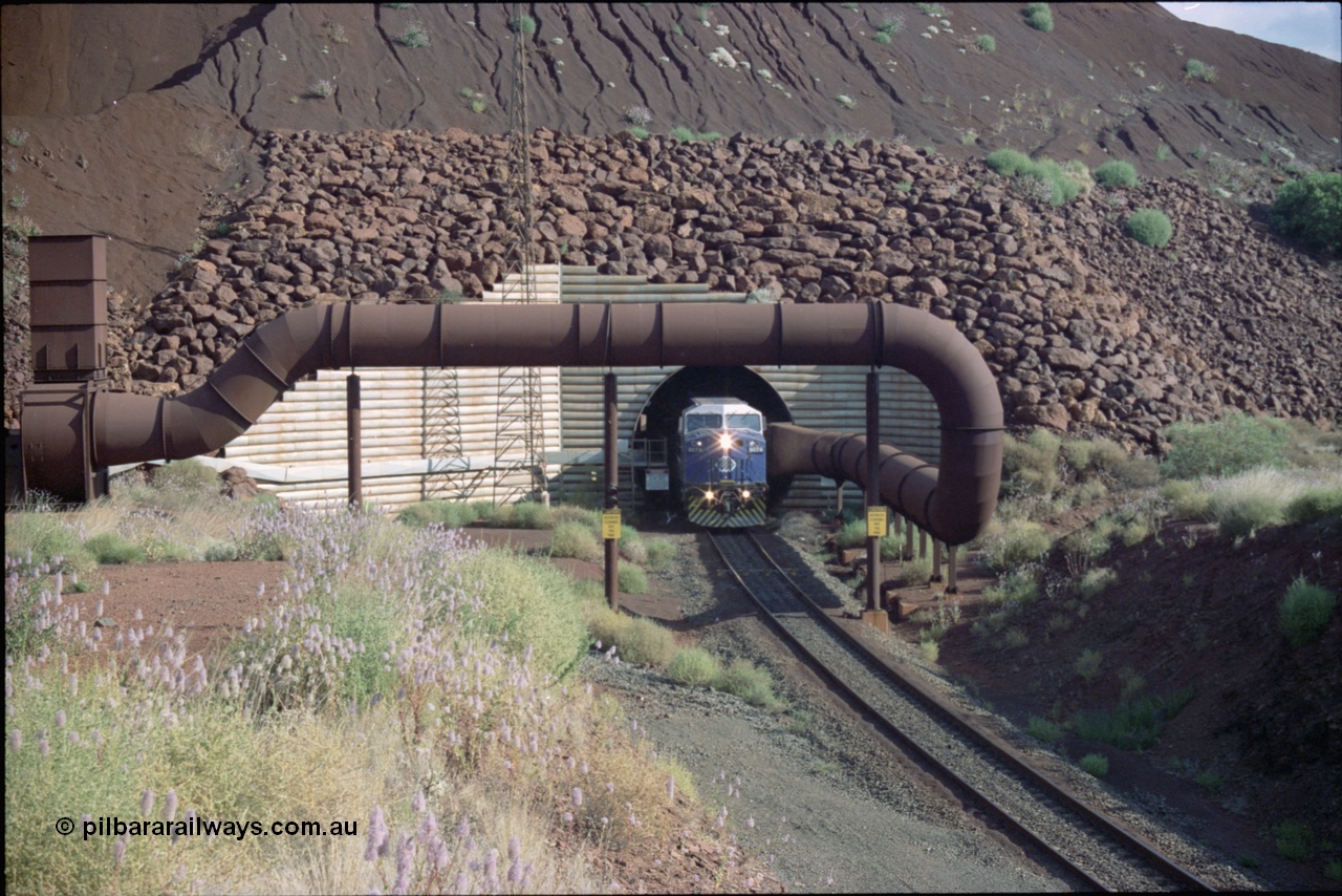 221-22
Yandi One mine loadout balloon loop, General Electric AC6000 class emerges from the loadout portal at 0.9 km/h as it leads a train through the loading vaults, the dust extraction ducting is also visible.
Keywords: GE;AC6000;51062-9;