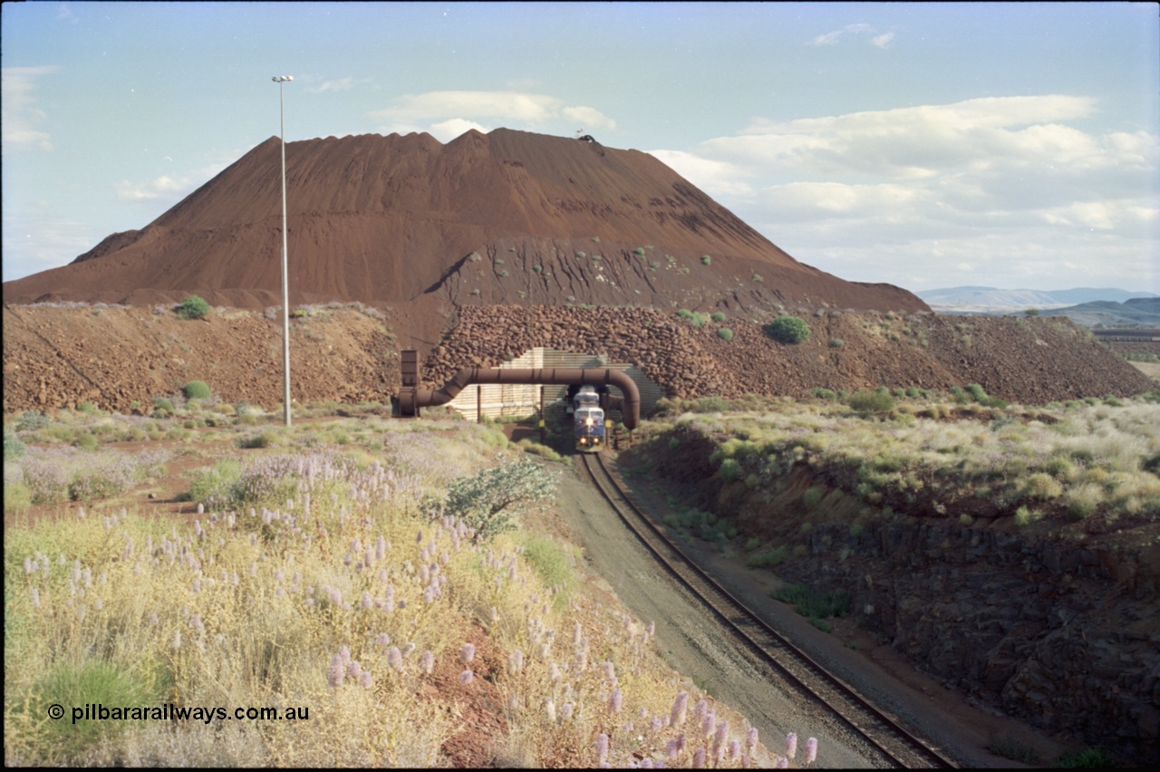 221-24
Yandi One mine loadout balloon loop, overview of the stockpile, the train can be seen in the middle distance on the right.
Keywords: GE;AC6000;51062-9;