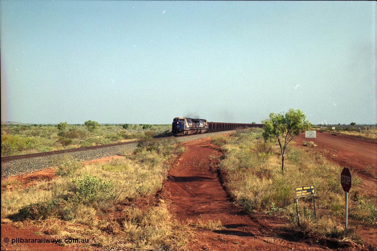 222-02
At the 105.7 km grade crossing near Gillam Siding, a loaded Yandi train approaches behind two General Electric AC6000 units built by GE at their Erie plant, BHP 6071 serial 51063 leads sister unit 6074, 6071 has not been named as yet. This road was also the original road into Lynas Find Gold Project, back in the day. [url=https://goo.gl/maps/7emwhQdnBN32]GeoData[/url].
Keywords: 6071;GE;AC6000;51063;