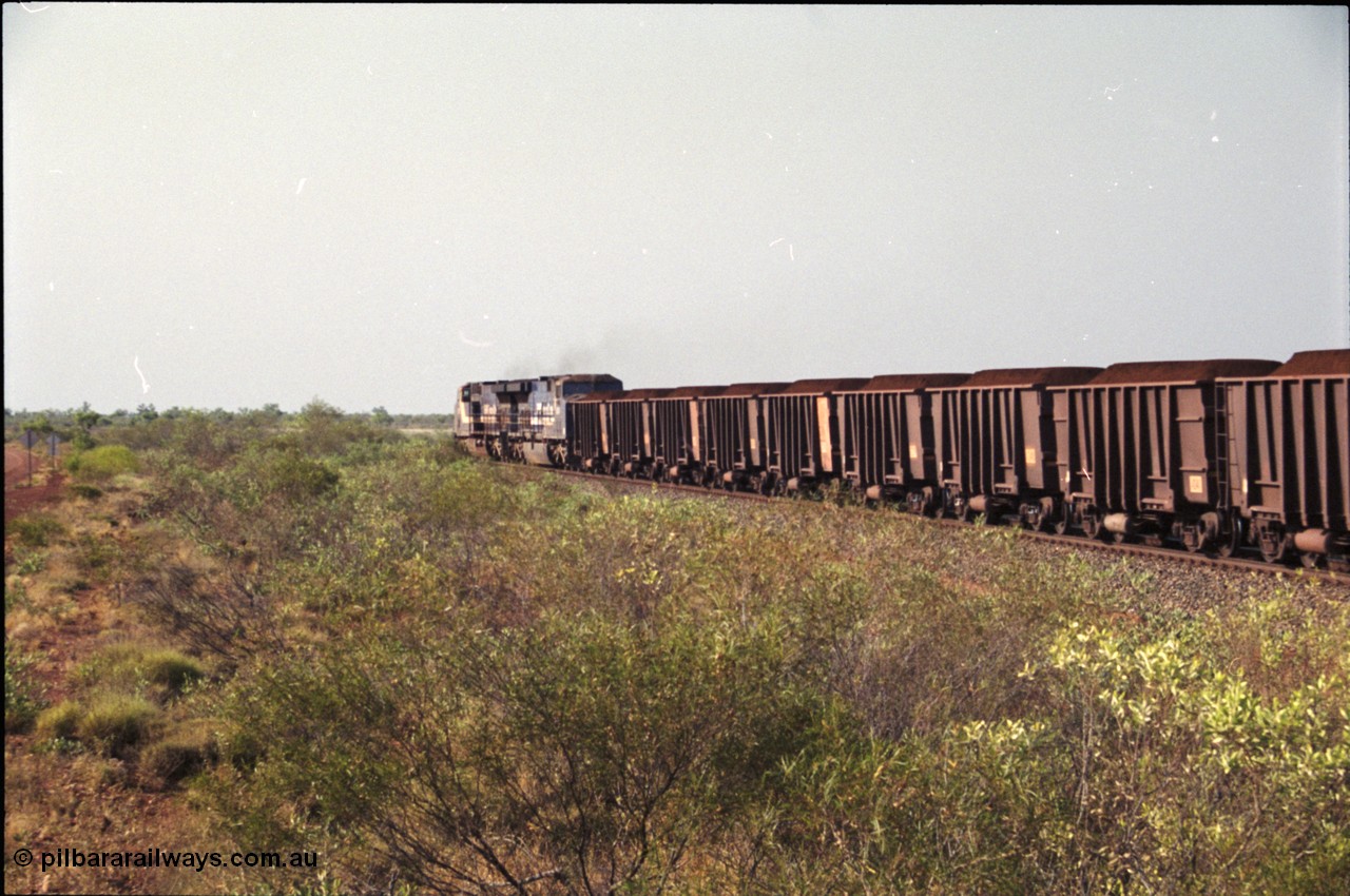 222-04
At the 105.7 km grade crossing near Gillam Siding, a loaded Yandi train departing behind two General Electric AC6000 units built by GE at their Erie plant. Gillam Siding is at the 97.1 km. [url=https://goo.gl/maps/7emwhQdnBN32]GeoData[/url].
