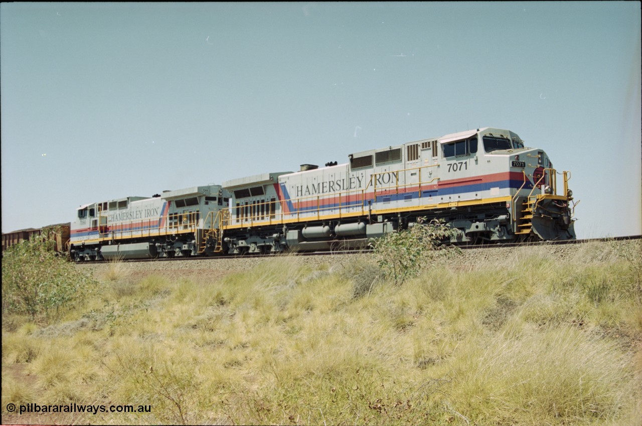222-17
Somewhere on the original single line section between Gull and Rosella Hamersley Iron 7071 serial 47750 a General Electric Dash 9-44CW built by GE at Erie brings a loaded train to a stand with 7066 for a crew change.
Keywords: 7071;GE;Dash-9-44CW;47750;