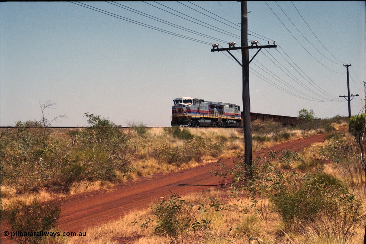 222-21
Somewhere on the original single line section between Gull and Rosella Hamersley Iron 7073 serial 47752 a General Electric Dash 9-44CW built by GE at Erie brings an empty train to a stop with 7091 for a crew change.
Keywords: 7073;GE;Dash-9-44CW;47752;