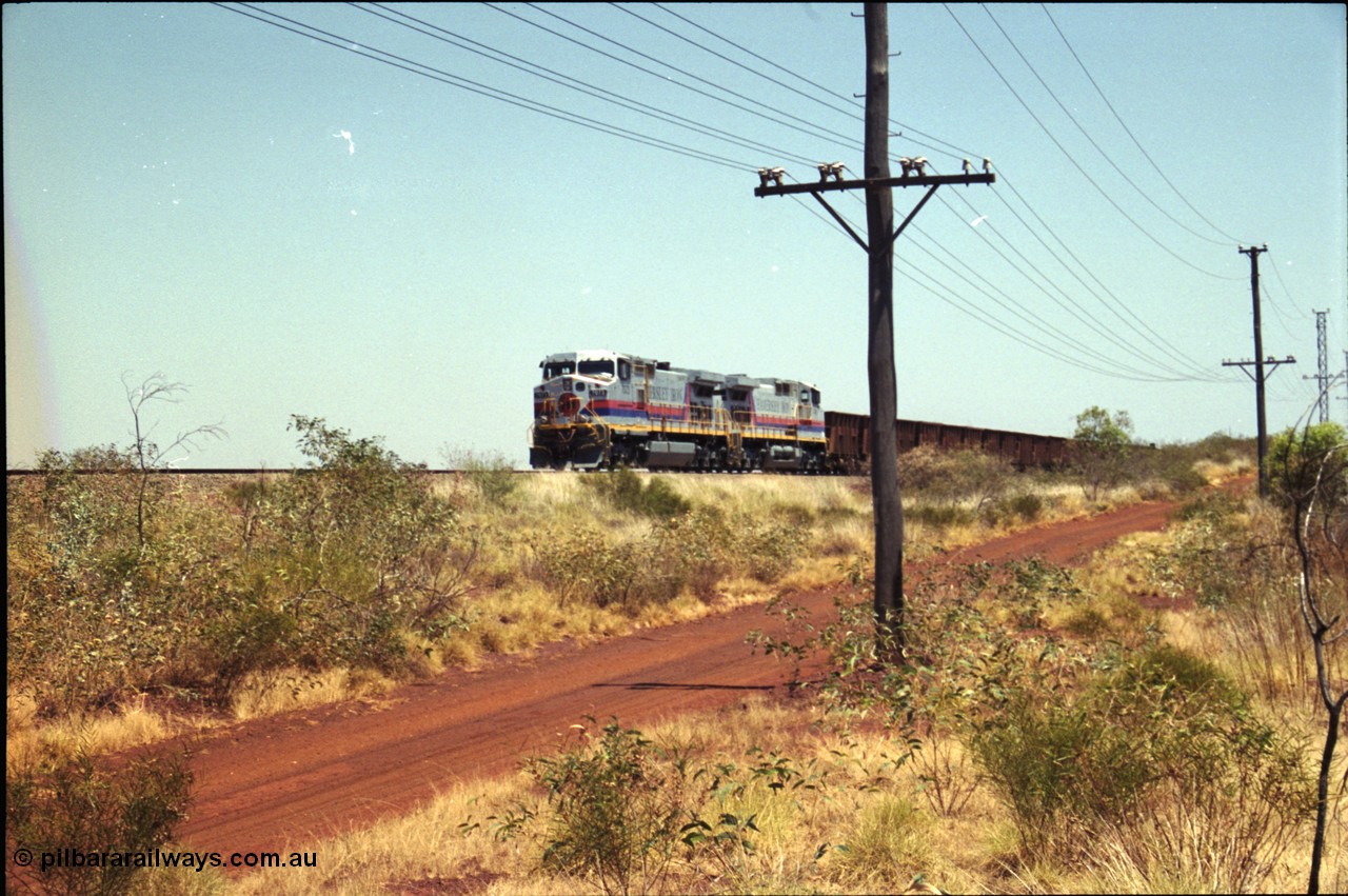 222-22
Somewhere on the original single line section between Gull and Rosella Hamersley Iron 7073 serial 47752 a General Electric Dash 9-44CW built by GE at Erie brings an empty train to a stop with 7091 for a crew change.
Keywords: 7073;GE;Dash-9-44CW;47752;