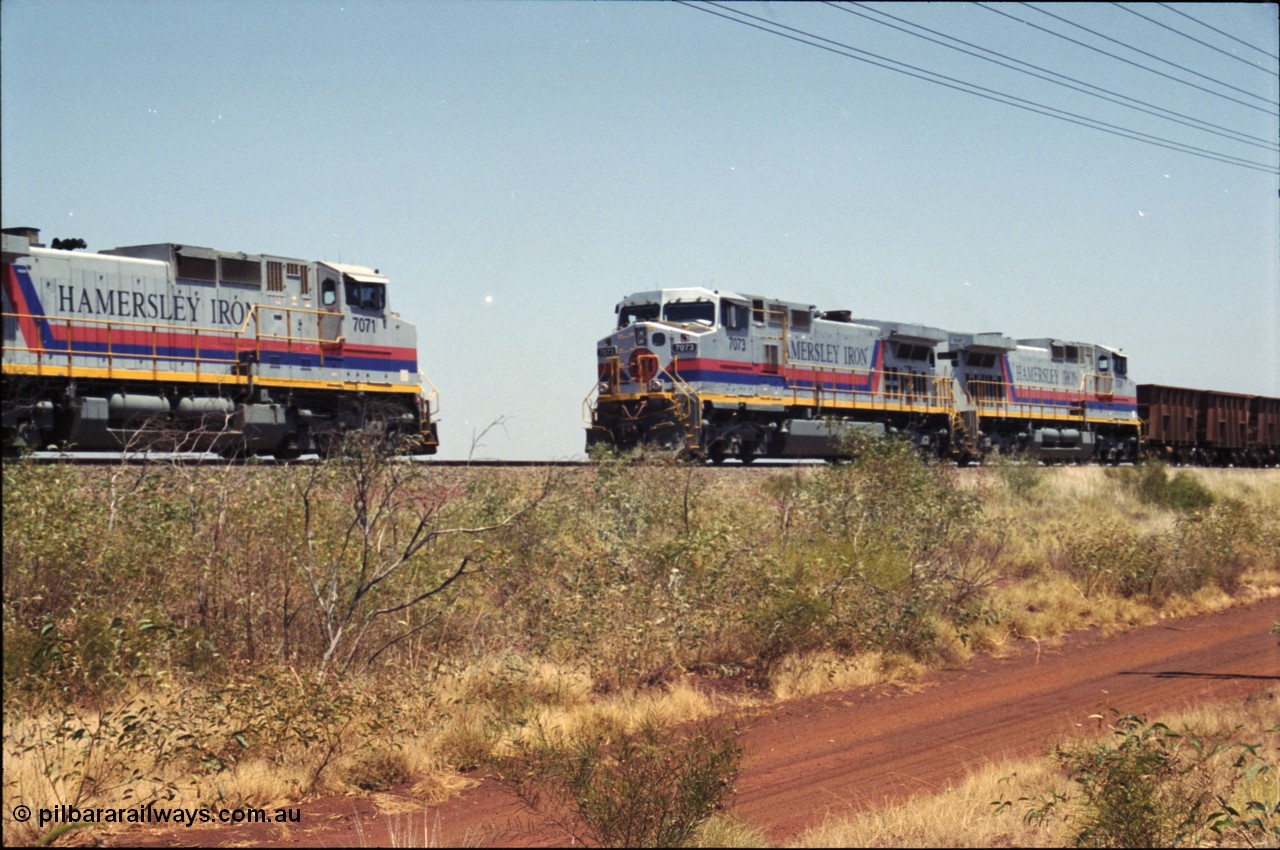 222-23
Somewhere on the original single line section between Gull and Rosella Hamersley Iron 7073 serial 47752 a General Electric Dash 9-44CW built by GE at Erie brings an empty train to a stop with 7091 for a crew change besides a loaded headed up by 7071.
Keywords: 7073;GE;Dash-9-44CW;47752;