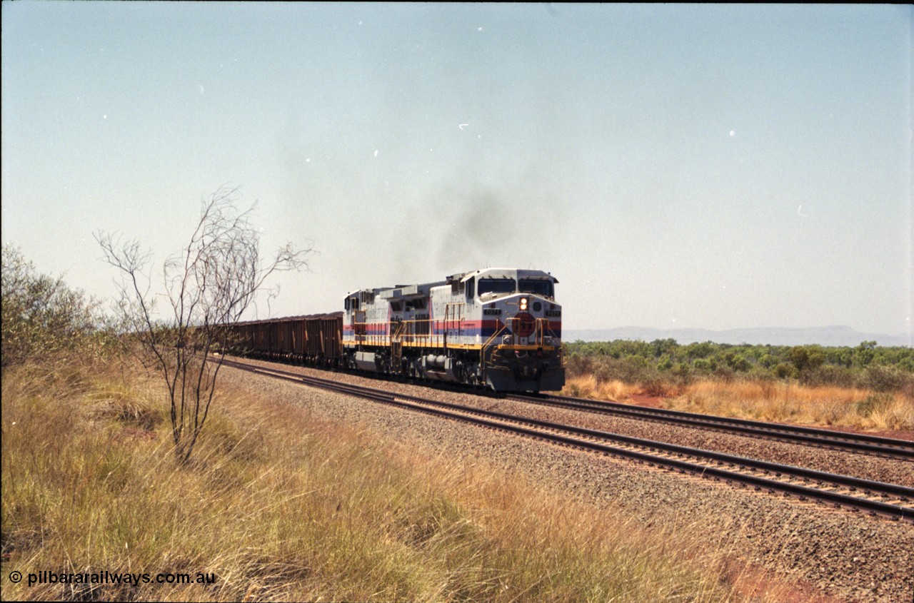 222-31
Somewhere on the original single line section between Gull and Rosella Hamersley Iron 7071 serial 47750 a General Electric Dash 9-44CW built by GE at Erie brings a loaded train away from the passing track back onto the mainline following a crew change with second unit 7066.
Keywords: 7071;GE;Dash-9-44CW;47750;