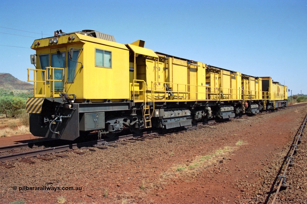 223-07
Possum Siding, Hamersley Iron rail grinder, Speno built RR 48 M-1 model sits in the back track siding. 21st October 2000.
Keywords: Speno;RR48;M1;rail-grinder;