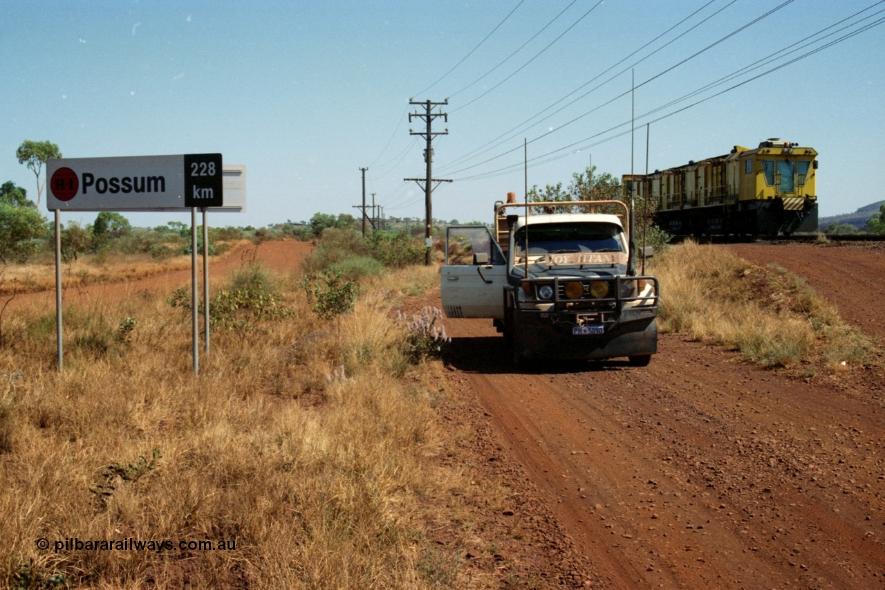 223-12
Possum Siding sign on the Hamersley Iron Dampier to Paraburdoo line, located 228 km from Dampier. 21st October 2000.
