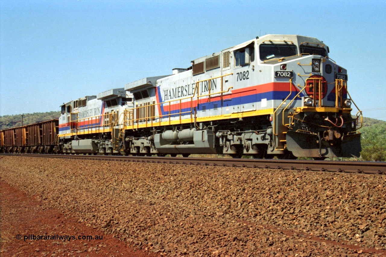 223-14
Possum Siding, Hamersley Iron loco 7082 a General Electric built Dash 9-44CW serial 47761 leads sister unit 7080 with an empty train just inside the loop waiting to effect a crew change. 21st October 2000.
Keywords: 7082;GE;Dash-9-44CW;47761;