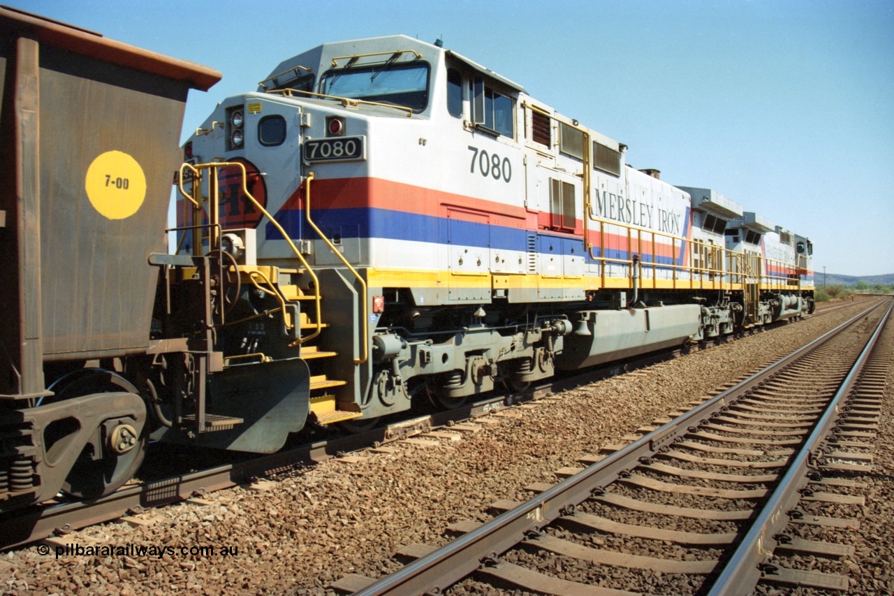223-16
Possum Siding, trailing view of Hamersley Iron loco 7080 a General Electric built Dash 9-44CW serial 47759 second unit behind sister locomotive 7082 looking south. 21st October 2000.
Keywords: 7080;GE;Dash-9-44CW;47759;