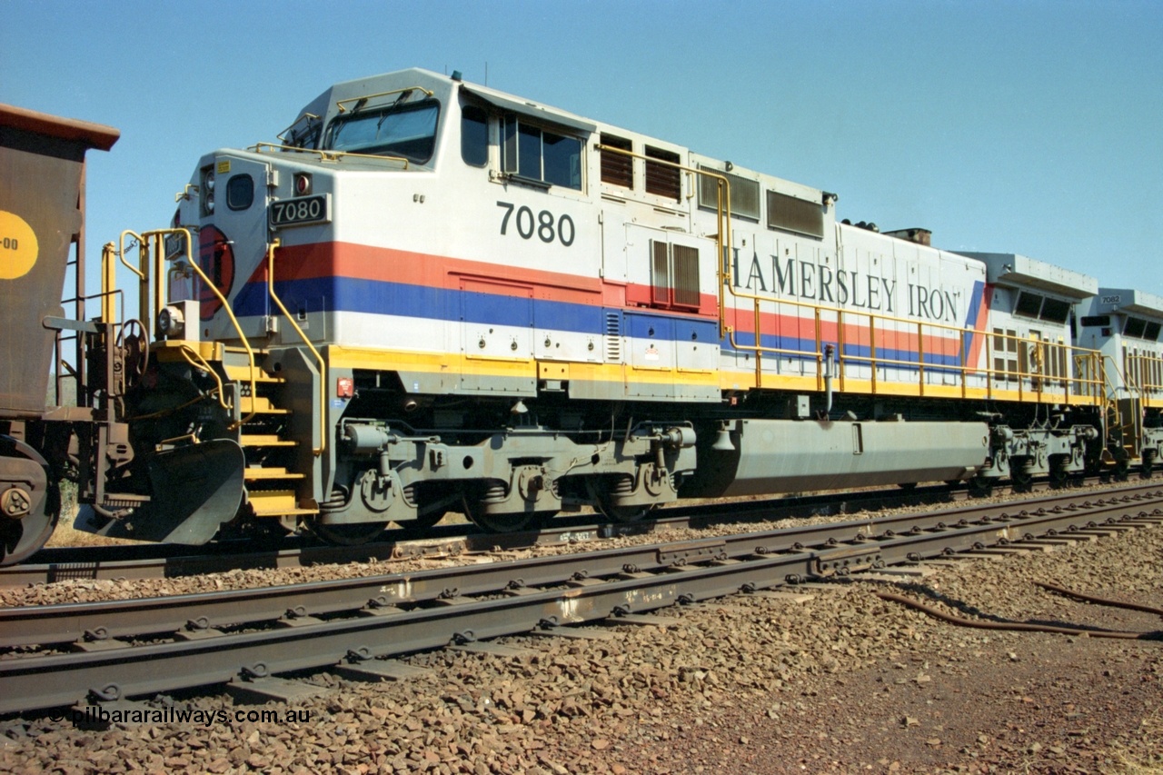 223-17
Possum Siding, trailing view of Hamersley Iron loco 7080 a General Electric built Dash 9-44CW serial 47759 second unit behind sister locomotive 7082 looking south. 21st October 2000.
Keywords: 7080;GE;Dash-9-44CW;47759;