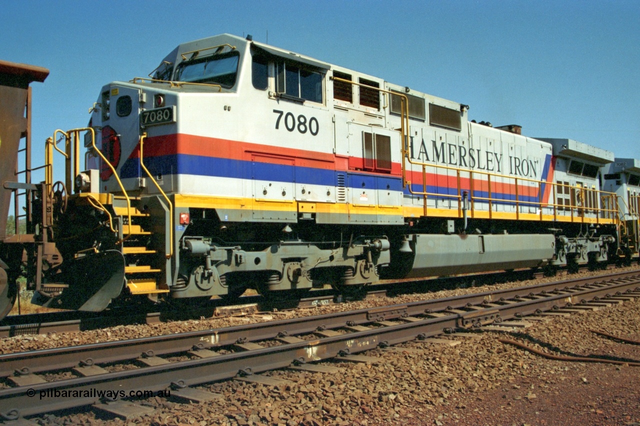 223-18
Possum Siding, trailing view of Hamersley Iron loco 7080 a General Electric built Dash 9-44CW serial 47759 second unit behind sister locomotive 7082 looking south. 21st October 2000.
Keywords: 7080;GE;Dash-9-44CW;47759;