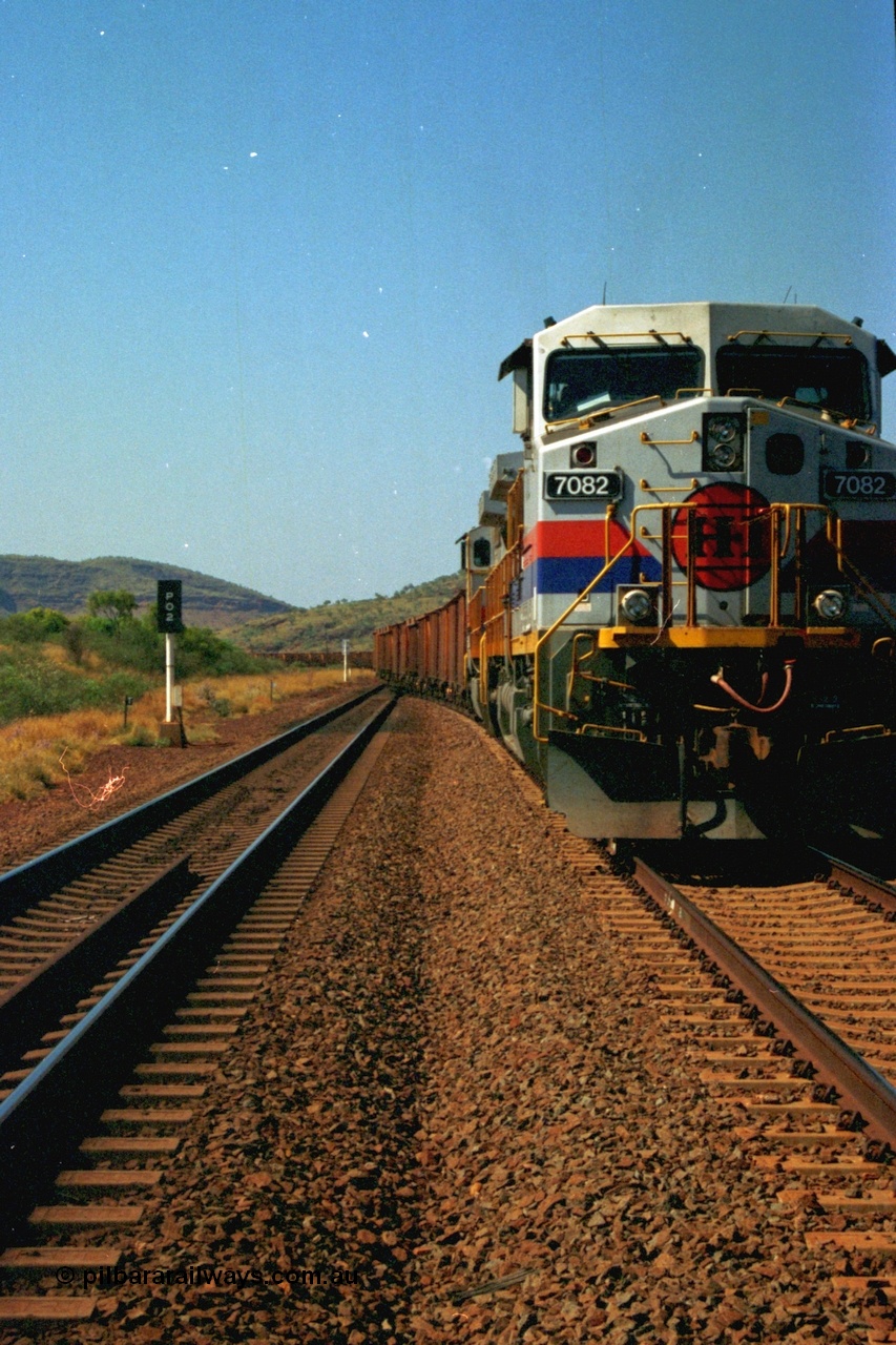 223-20
Possum Siding, Hamersley Iron loco 7082 a General Electric built Dash 9-44CW serial 47761 leads sister unit 7080 with an empty train just inside the loop waiting to effect a crew change. 21st October 2000.
Keywords: 7082;GE;Dash-9-44CW;47761;
