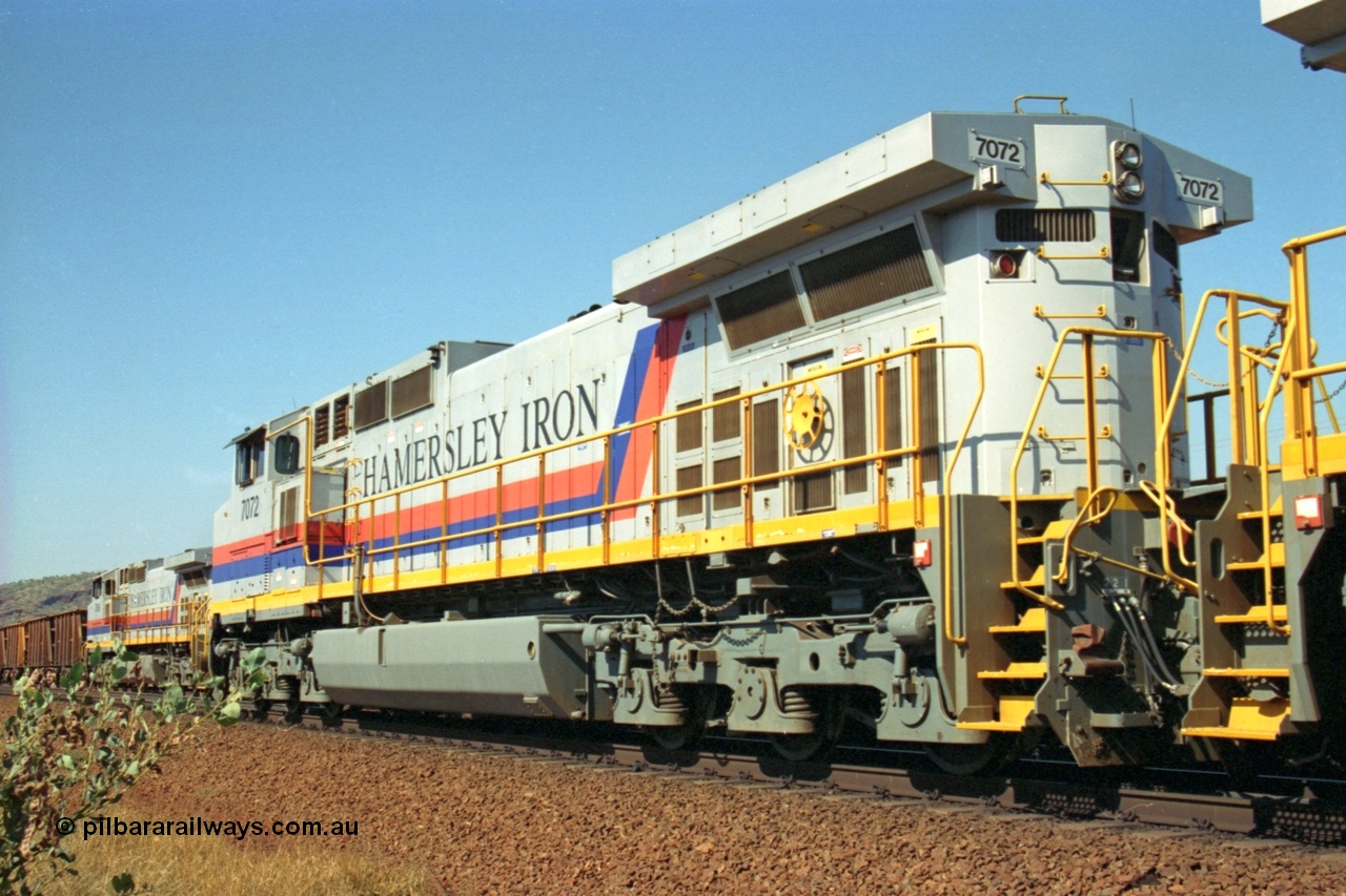 223-29
Possum Siding, rear view of Hamersley Iron loco 7072 a General Electric built Dash 9-44CW model serial 47751 leads sister unit 7074 with a loaded train as they effect a crew change. 21st October 2000.
Keywords: 7072;GE;Dash-9-44CW;47751;