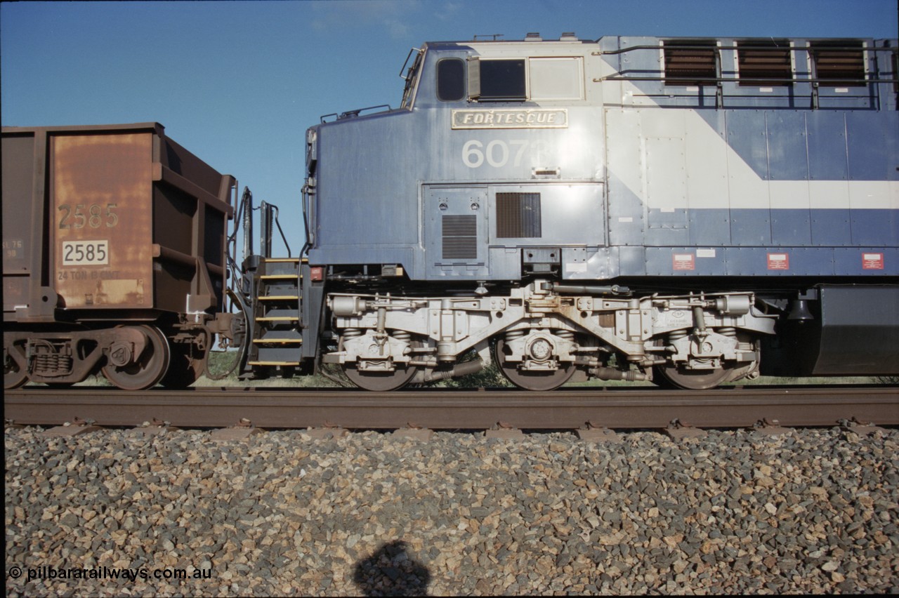 224-09
Bing siding, 6073 'Fortescue' serial 51065 a General Electric AC6000 built by GE at Erie awaits the road to depart south, cab side shows new nameplate, steerable bogie and taper in cab side. [url=https://goo.gl/maps/KQrczNpVhAH2]GeoData[/url].
Keywords: 6073;GE;AC6000;51065;