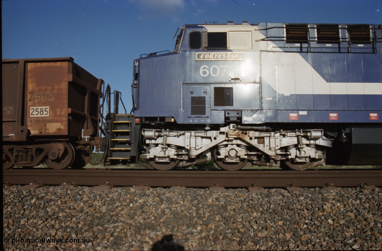 224-10
Bing siding, 6073 'Fortescue' serial 51065 a General Electric AC6000 built by GE at Erie awaits the road to depart south, cab side shows new nameplate, steerable bogie and taper in cab side. [url=https://goo.gl/maps/KQrczNpVhAH2]GeoData[/url].
Keywords: 6073;GE;AC6000;51065;