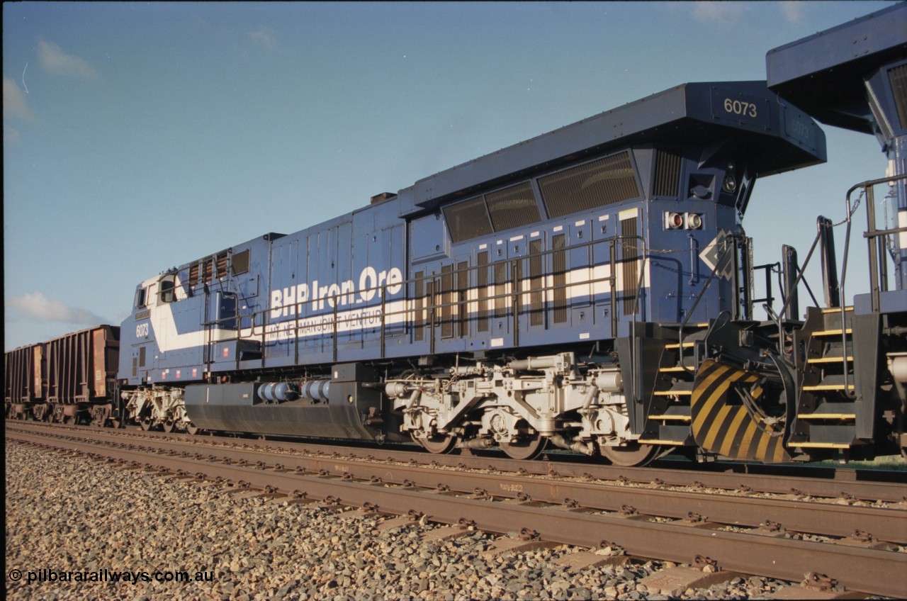 224-14
Bing siding, 6073 'Fortescue' serial 51065 a General Electric AC6000 built by GE at Erie awaits the road to depart south, radiator, steerable bogie and taper in cab side. [url=https://goo.gl/maps/KQrczNpVhAH2]GeoData[/url].
Keywords: 6073;GE;AC6000;51065;