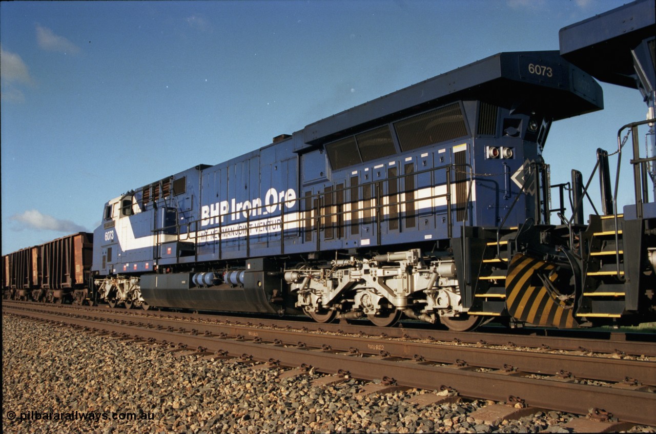 224-15
Bing siding, 6073 'Fortescue' serial 51065 a General Electric AC6000 built by GE at Erie awaits the road to depart south, radiator, steerable bogie and taper in cab side. [url=https://goo.gl/maps/KQrczNpVhAH2]GeoData[/url].
Keywords: 6073;GE;AC6000;51065;