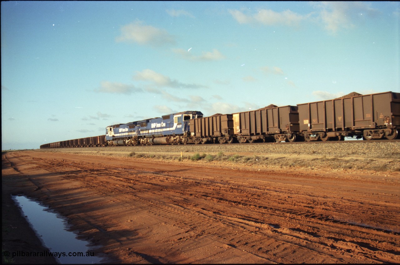 224-26
Bing siding, the afternoon empty to Yandi waits in the loop as a loaded behind two Goninan rebuilt CM40-8M GE units rolls through on the mainline, 5637 'De Grey' serial 8181-01 / 92-123 trails sister unit 5642 'Wallareenya'. [url=https://goo.gl/maps/KQrczNpVhAH2]GeoData[/url].
Keywords: 5637;Goninan;GE;CM40-8M;8181-01/92-123;rebuild;AE-Goodwin;ALCo;C636;5456;G6012-5;