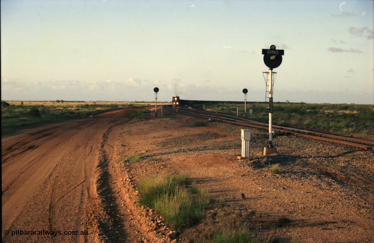224-29
Bing siding, the afternoon empty to Yandi was a staple of the AC6000 units when delivered, operating the train as a pair, 112 waggons, AC6000 and 112 waggons. 6076 'Mt Goldsworthy' serial 51068 a General Electric AC6000 built by GE at Erie departs the loop south with sister unit 6073. [url=https://goo.gl/maps/KQrczNpVhAH2]GeoData[/url].
