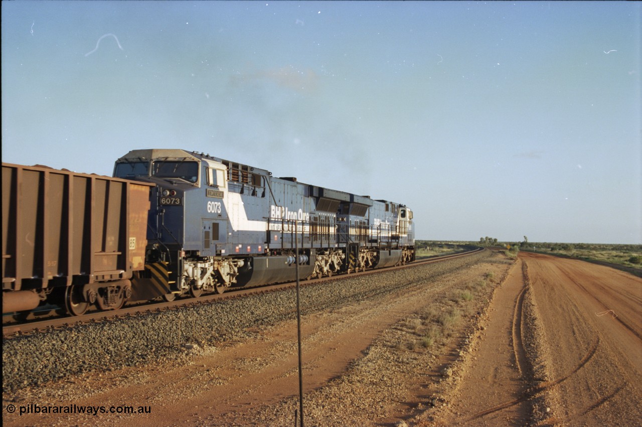 224-35
Bing siding, 6073 'Fortescue' serial 51065 a General Electric AC6000 built by GE at Erie departs south. [url=https://goo.gl/maps/KQrczNpVhAH2]GeoData[/url].
Keywords: 6073;GE;AC6000;51065;