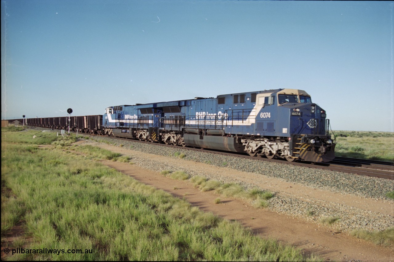 225-06
Bing siding, the afternoon empty train to Yandi was a double AC6000, 112 waggons, AC6000 and 112 waggons for a long time, here's one on approach behind General Electric AC6000 6074 serial 51066 built by GE at Erie with sister unit 6075 as second unit before the locos were named. [url=https://goo.gl/maps/r3bVfZz8aJS2]GeoData[/url].
Keywords: 6074;GE;AC6000;51066;