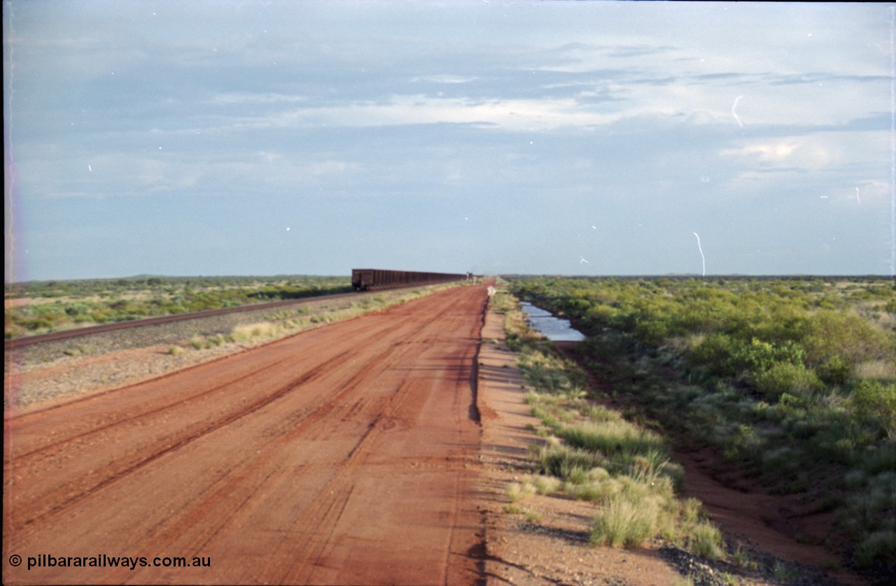 225-26
24.1 km grade crossing on the Newman line, empty train racing off into the distance. [url=https://goo.gl/maps/qGkyfiuy6212]GeoData[/url].
