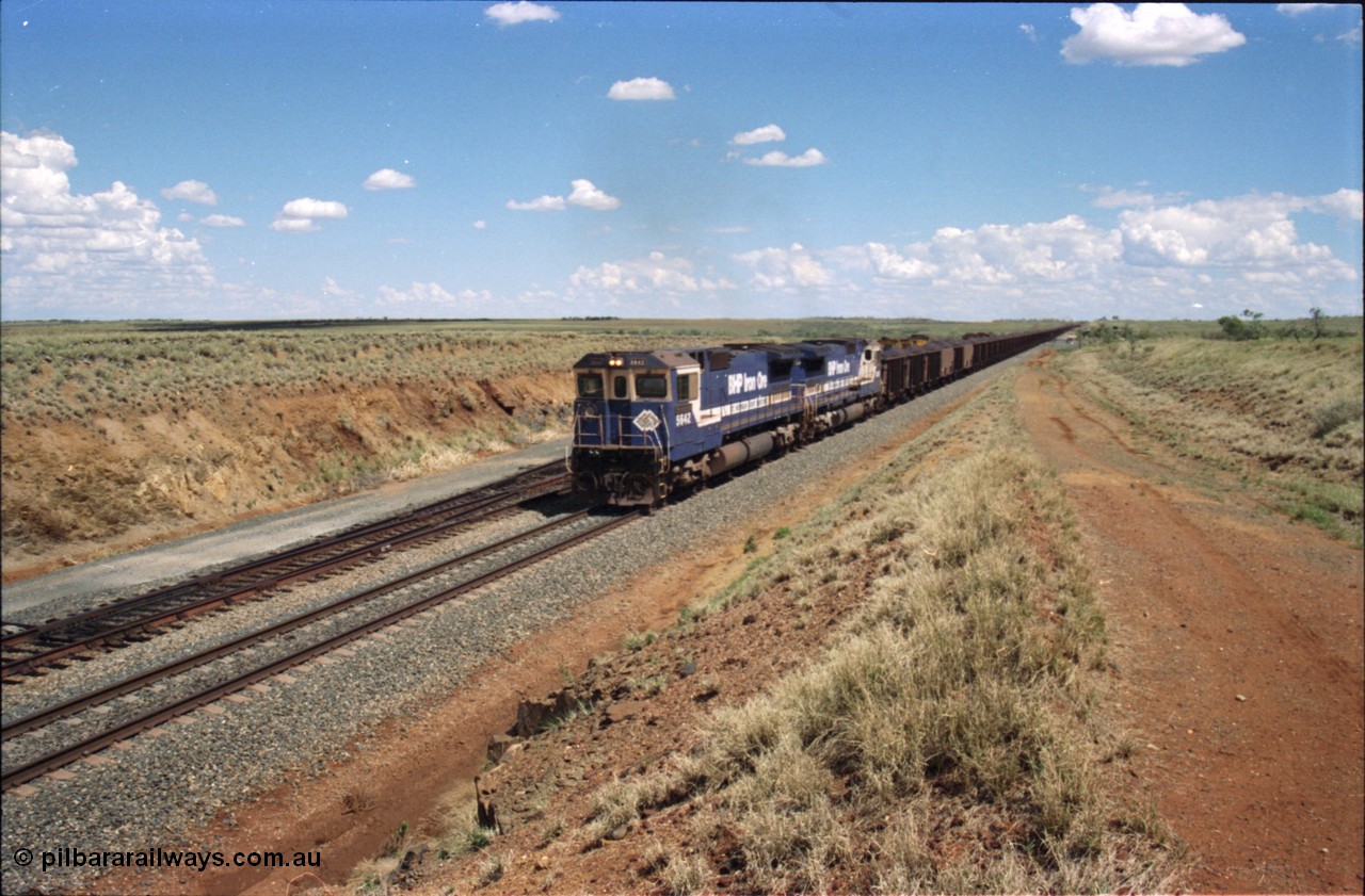 226-27
Shaw siding at the 219 km a loaded train with power from two Goninan CM40-8M GE rebuild units 5642 'Wallareenya' serial 8281-07 / 92-131 and sister unit 5636, the mid-train remotes can be seen in the distance topping the grade. [url=https://goo.gl/maps/JLjSYskHScU2]GeoData[/url].
Keywords: 5642;Goninan;GE;CM40-8M;8281-07/92-131;rebuild;AE-Goodwin;ALCo;C636;5467;G6041-3;
