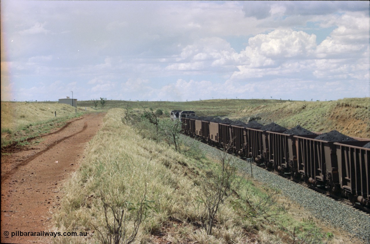 226-30
Shaw siding, the loaded train heading north behind two Goninan CM40-8M GE rebuild units with loaded Comeng WA built waggons and a couple of the smooth sided experimental Comeng waggons. [url=https://goo.gl/maps/JLjSYskHScU2]GeoData[/url].
