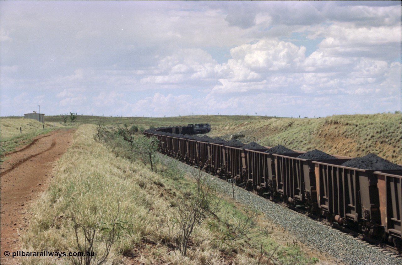 226-31
Shaw siding, the loaded train heading north around the 698 metre radius curve behind two Goninan CM40-8M GE rebuild units with loaded Comeng WA built waggons. [url=https://goo.gl/maps/JLjSYskHScU2]GeoData[/url].
