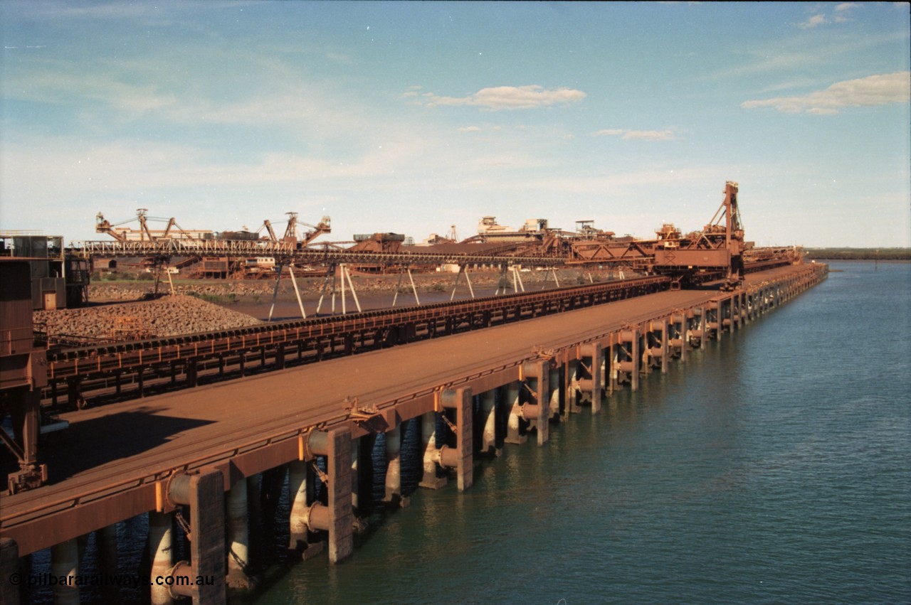 227-03
Nelson Point, view along A and B berths from Shiploader 2, Shiploader 1 on B berth, reclaimers 3 and 4 visible behind the under harbour tunnel feed conveyor. [url=https://goo.gl/maps/9YFk9Z8c7WG2]GeoData[/url].
