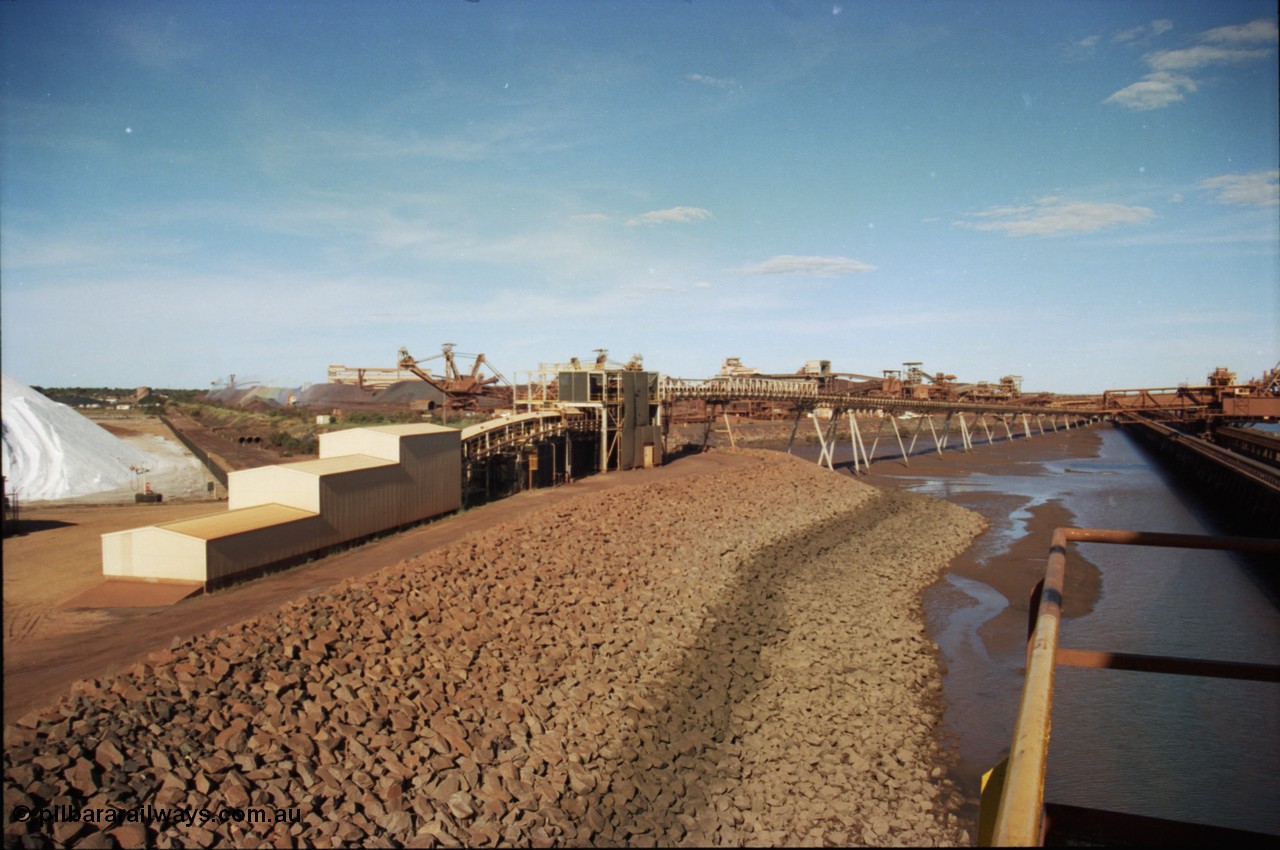 227-08
Nelson Point, view along the rear of A and B berths from Shiploader 2, salt pile on the left, then the under harbour tunnel portal, old reclaimers 3 and 4 with the crushing building in the distance, which has now been demolished, and the rear of Shiploader 1 on B berth. [url=https://goo.gl/maps/1sLxDMF5tZu]GeoData[/url].

