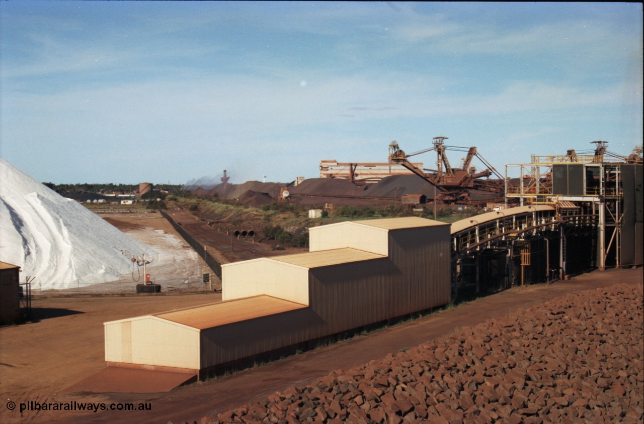 227-13
Nelson Point, view from rear of Shiploader 2, salt pile, manganese stockpile in the distance, stacker 3, the Port Hedland water tower, then 101-102 sample station and Tertiary Crushing Building One or TCB1, stacker 4 and reclaimer 3 with the under harbour portal in the foreground. [url=https://goo.gl/maps/1sLxDMF5tZu]GeoData[/url].
