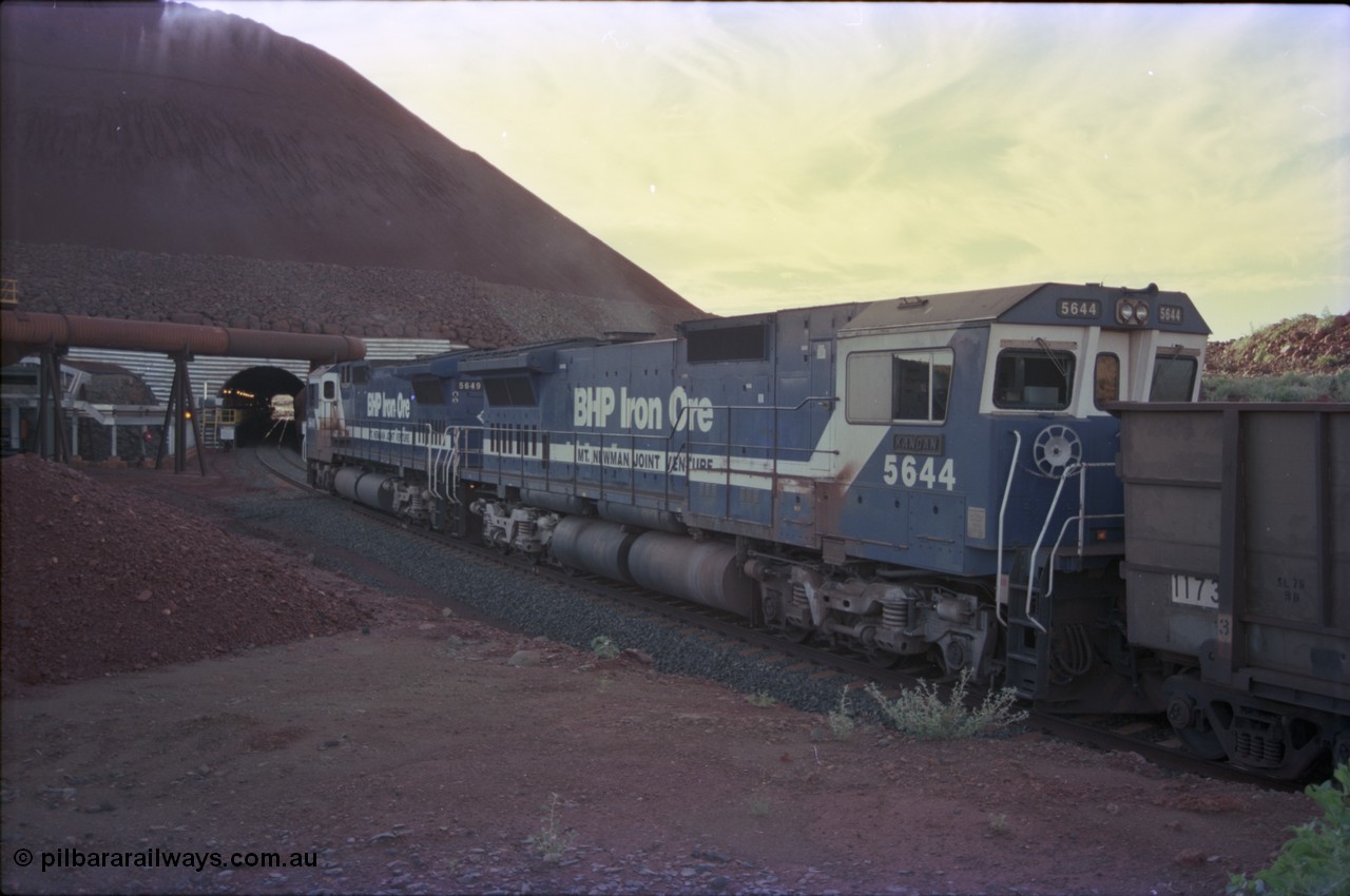 228-30
Yandi Two load-out tunnel, trailing view of empty train about to enter for loading behind a standard pair of Goninan rebuilt GE CM40-8M model units 5649 'Pohang' serial 8412-07/93-140 and 5644 'Kangan' serial 8281-09/92-133. Geodata [url=https://goo.gl/maps/KbzBN9Bt4k52] -22.720824, 119.043410 [/url].
Keywords: 5644;Goninan;GE;CM40-8M;8281-09/92-133;rebuild;AE-Goodwin;ALCo;M636C;5471;G6047-3;