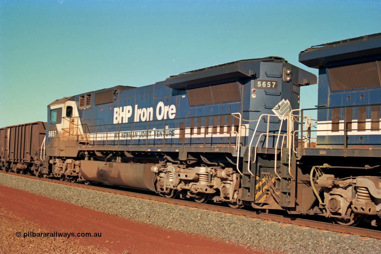 229-09
Yandi Two at the 311.5 km, empty BHP train mid-train Goninan rebuild CM40-8M GE units 5657 'Fukuyama' serial 8412-02 / 94-148 trailing remote unit. [url=https://goo.gl/maps/DcycDGojcBt]GeoData[/url].
Keywords: 5657;Goninan;GE;CM40-8M;8412-02/94-148;rebuild;Comeng-NSW;ALCo;M636C;5492;C6084-8;