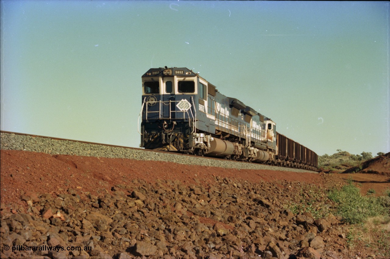 231-02
Yandi Two balloon loop, BHP Iron Ore 5652 'Villanueva' serial 8412-09 / 93-143 an Goninan WA rebuild CM40-8M GE unit loads a train at 1.2 km/h with second unit 5650. [url=https://goo.gl/maps/3vQHZqBXNa32]GeoData[/url].
Keywords: 5652;Goninan;GE;CM40-8M;8412-09/93-143;rebuild;AE-Goodwin;ALCo;M636C;5482;G6061-3;