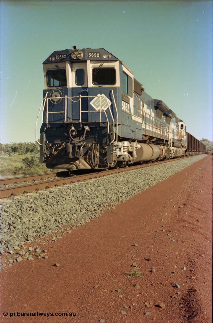 231-10
Yandi Two balloon loop, BHP Iron Ore 5652 'Villanueva' serial 8412-09 / 93-143 an Goninan WA rebuild CM40-8M GE unit loads a train at 1.2 km/h with second unit 5650. [url=https://goo.gl/maps/3vQHZqBXNa32]GeoData[/url].
Keywords: 5652;Goninan;GE;CM40-8M;8412-09/93-143;rebuild;AE-Goodwin;ALCo;M636C;5482;G6061-3;