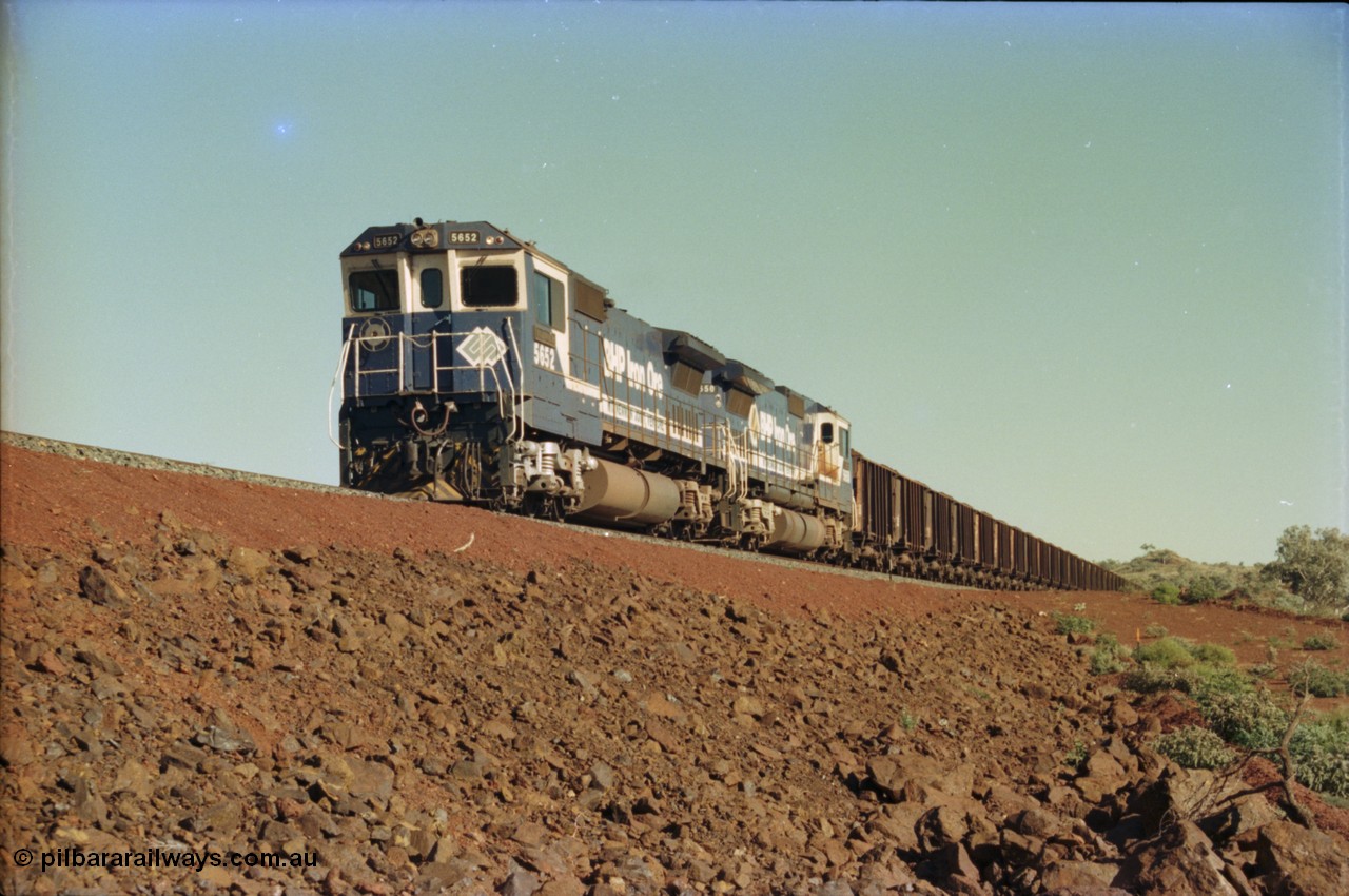 231-18
Yandi Two balloon loop, BHP Iron Ore 5652 'Villanueva' serial 8412-09 / 93-143 an Goninan WA rebuild CM40-8M GE unit loads a train at 1.2 km/h with second unit 5650. [url=https://goo.gl/maps/3vQHZqBXNa32]GeoData[/url].
Keywords: 5652;Goninan;GE;CM40-8M;8412-09/93-143;rebuild;AE-Goodwin;ALCo;M636C;5482;G6061-3;