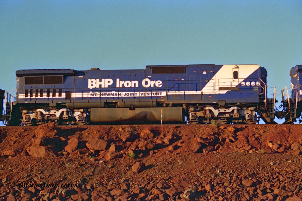 232-07
Yandi One balloon loop cabless BHP Iron Ore Goninan rebuild CM40-8ML (L for LocoTrol) GE unit 5665 'Rotterdam' serial 8412-10 / 94-156 in the mid-train remote power of train no. 1718 which is partway through loading on the afternoon of 3rd of February 1997. [url=https://goo.gl/maps/JhTwdFuTRZo]GeoData[/url].
Keywords: 5665;Goninan;GE;CM40-8ML;8412-10/94-156;rebuild;Comeng-NSW;ALCo;M636C;5491;C6084-7;