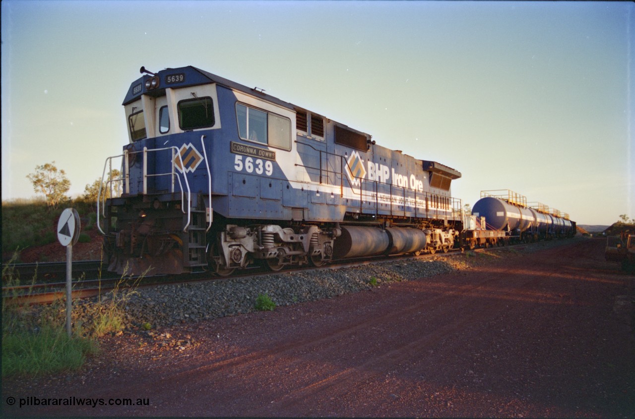 232-16
Yandi One backtrack, following a cyclone shutdown of the mainline and severe flooding around Yandi a 'mixed' freight train was operated to Yandi to deliver food, mail and diesel fuel to the mine and camp. Here BHP Iron Ore CM40-8M unit 5639 'Corunna Downs' serial 8281-03 / 92-128 idles away in the backtrack awaiting its path back to Port Hedland with flat waggon 6703, four fuel tank waggons and a broken ore waggon. February 1997. [url=https://goo.gl/maps/6c1WFqjYSg42]GeoData[/url].
Keywords: 5639;Goninan;GE;CM40-8M;8281-03/92-128;rebuild;AE-Goodwin;ALCo;C636;5459;G6027-3;