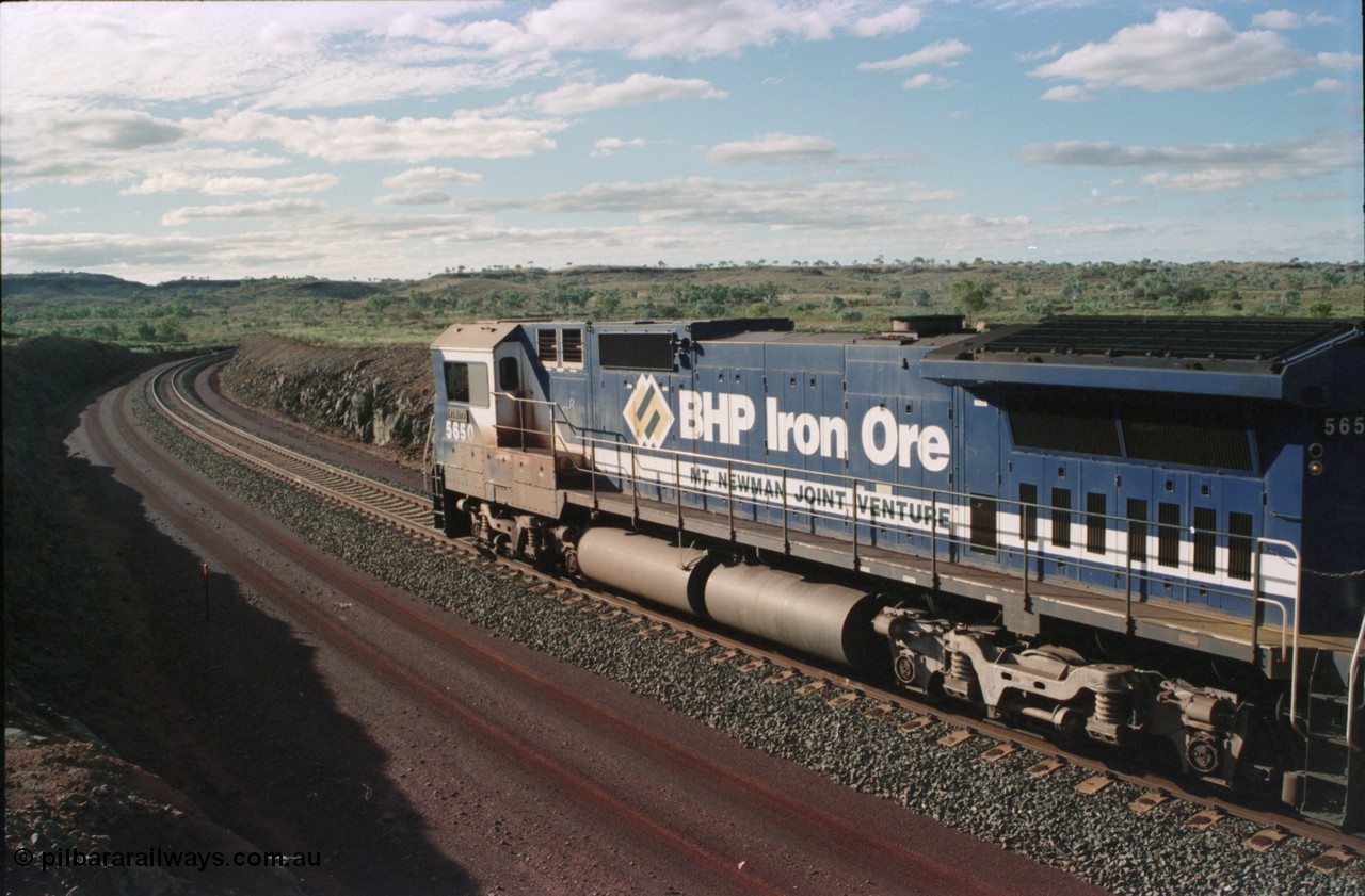 233-31
Yandi Two loaded car side of load-out tunnel, a loading train lead by BHP Iron Ore's Goninan rebuild CM40-8M GE unit 5650 'Yawata' serial 8412-07 / 93-141 as it drags the train through at 1.2 km/h. [url=https://goo.gl/maps/gXRbfYH9U482]GeoData[/url].
Keywords: 5650;Goninan;GE;CM40-8M;8412-07/93-141;rebuild;AE-Goodwin;ALCo;M636C;5481;G6061-2;