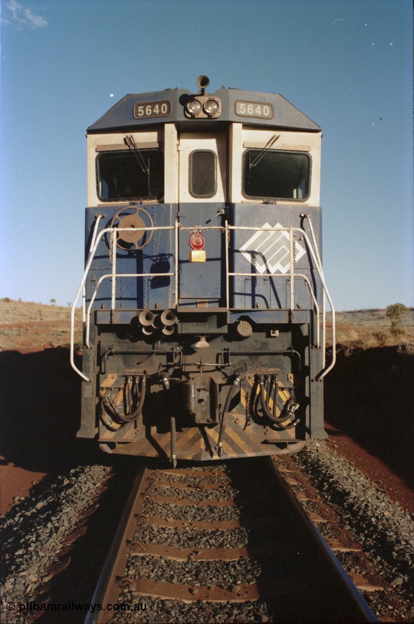 234-01
Yandi Two, BHP Iron Ore Goninan rebuild CM40-8M GE unit 5640 'Ethel Creek' serial 8281-05 / 92-129 is on the rear of a 240 waggon loaded train, this configuration was trialled for a time with two Dash 8 locos, 120 waggons, Dash 8, 120 waggons and Dash 8. As this series of rebuilds has no marker lights not the red lantern attached to the hand rail. Circa 1998.
Keywords: 5640;Goninan;GE;CM40-8M;8281-05/92-129;rebuild;AE-Goodwin;ALCo;M636C;5479;G6047-11;