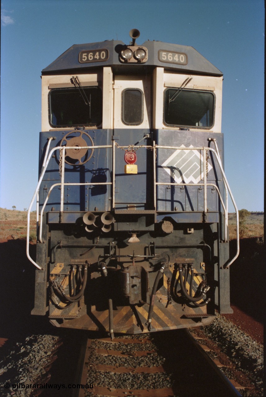 234-04
Yandi Two, BHP Iron Ore Goninan rebuild CM40-8M GE unit 5640 'Ethel Creek' serial 8281-05 / 92-129 is on the rear of a 240 waggon loaded train, this configuration was trialled for a time with two Dash 8 locos, 120 waggons, Dash 8, 120 waggons and Dash 8. As this series of rebuilds has no marker lights not the red lantern attached to the hand rail. Circa 1998.
Keywords: 5640;Goninan;GE;CM40-8M;8281-05/92-129;rebuild;AE-Goodwin;ALCo;M636C;5479;G6047-11;